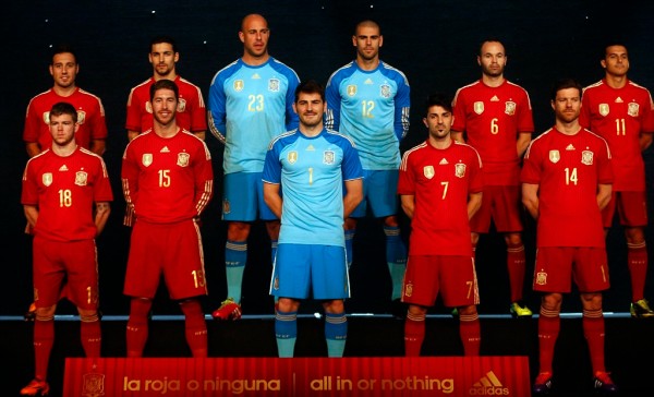 Spain's national soccer team players wearing new Spanish kit for the upcoming 2014 World Cup stand on the stage during a presentation ceremony in Madrid